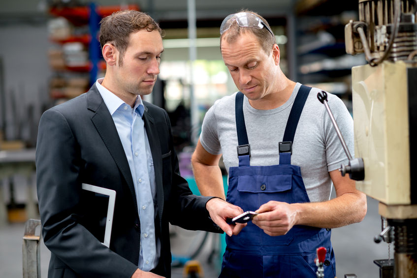 34485634 – in the factory- young boss and worker in conversation 34485634 – in the factory- young boss and worker in conversation